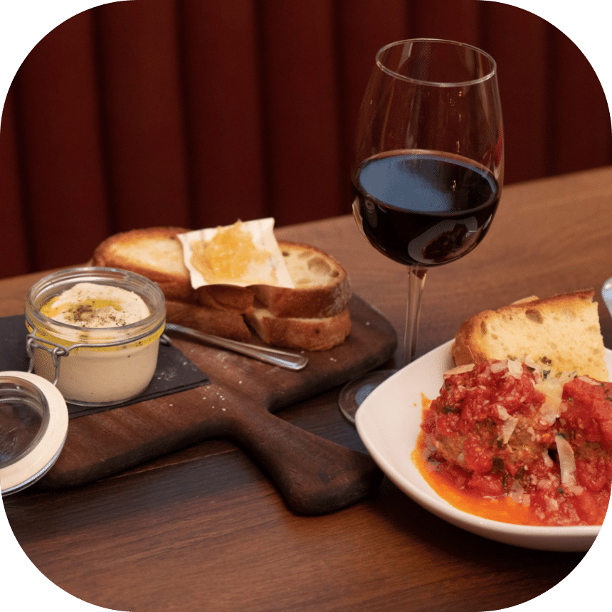 elevate-column-1@2x food and a glass of wine on Little Italy walking food tour