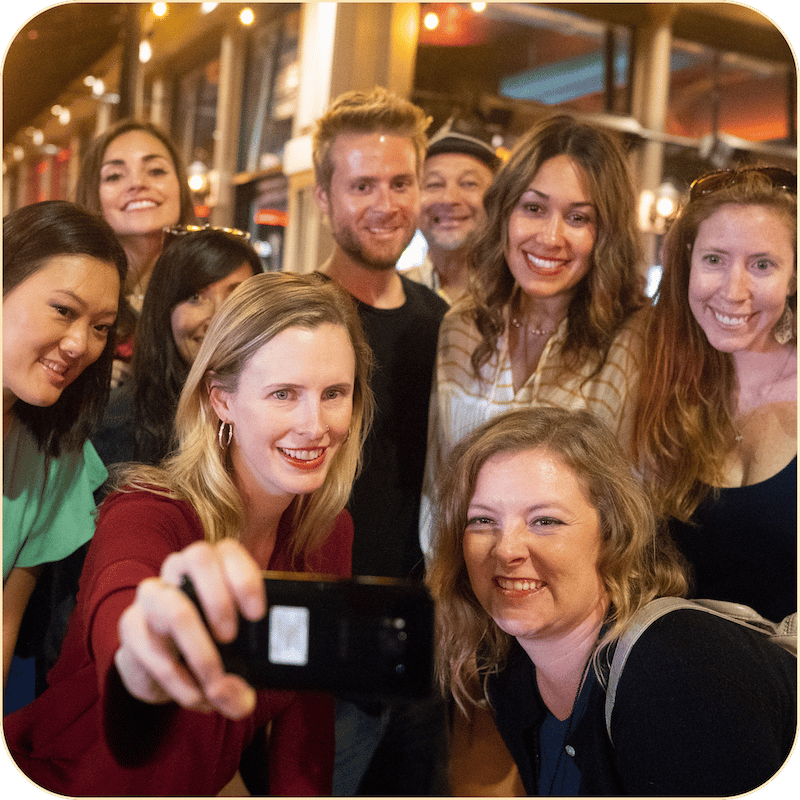 A group taking a selfie during a team building activity in San Diego