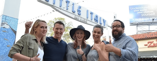 Happy group of people enjoying Pizza, Pasta and Piazzas San Diego food tour