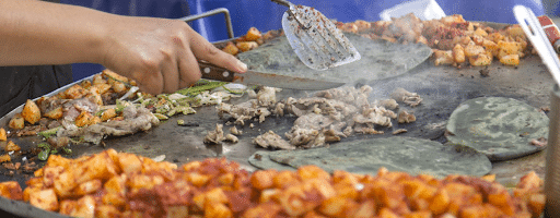 Food being cooked at Mexican Street Food in San Diego