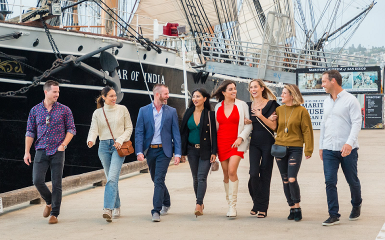 tour group walking in front of large ship
