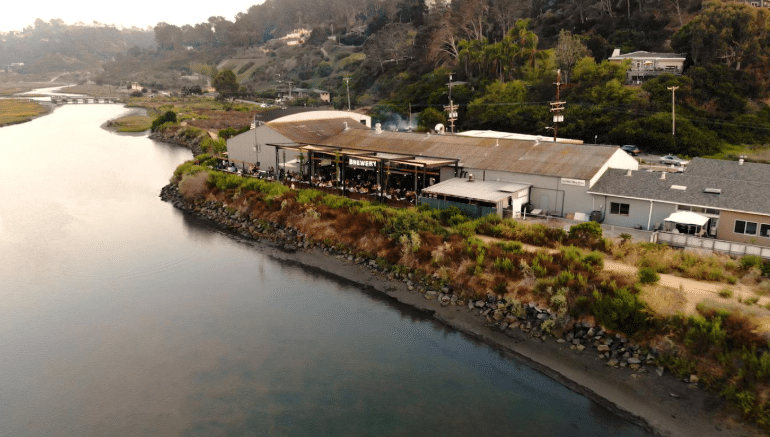 outdoor dining area facing the lagoon at a kid-friendly brewery in san diego