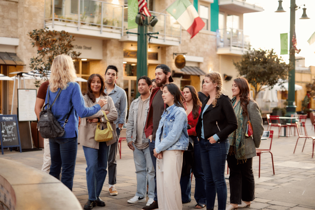 tour guide leads food tour group